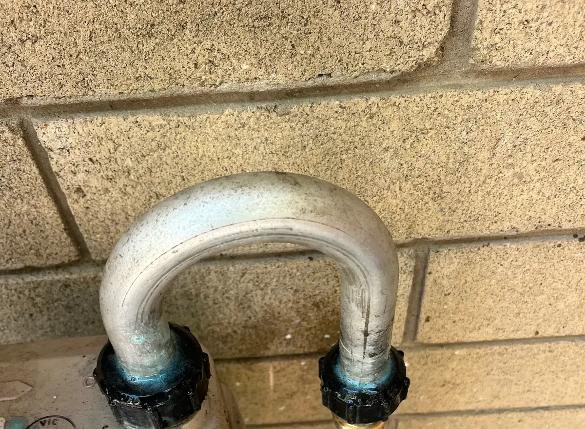 Gas meter with copper pipe connection and a small compliance label