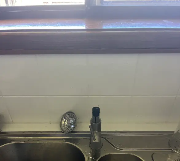 Stainless steel double kitchen sink with a mixer tap